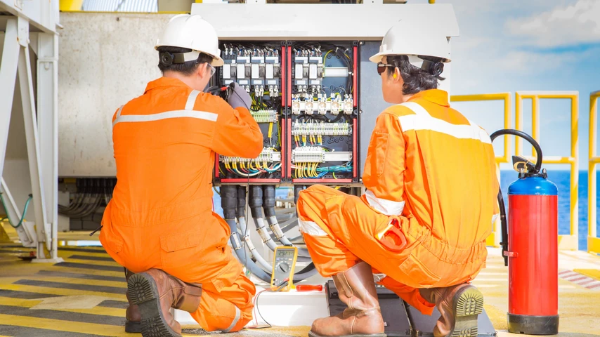 electricians working on equipment